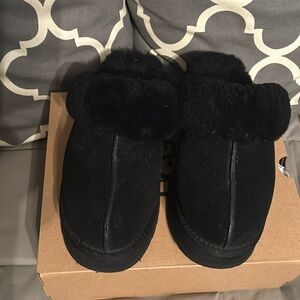UGG platform black slippers.